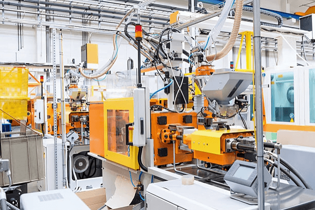 Plastic injection molding machine in operation